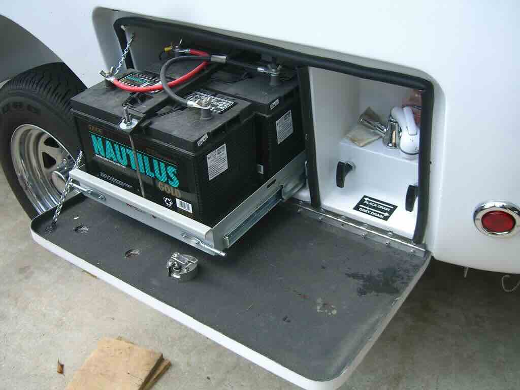 Mobile RV electrical repair technician working on RV battery and power systems